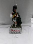 An old and rare Dewar's Scotch whisky figure