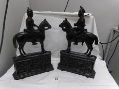 A pair of cast iron door stops