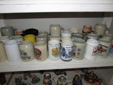 A large quantity of ceramic tankards