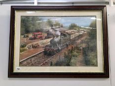 A framed and glazed steam train print