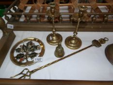 A pair of brass candlesticks,