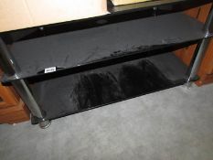 A black glass television stand