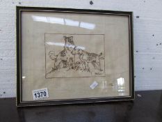 A framed embroidery of dogs