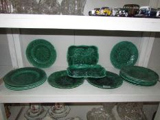 14 green 'leaf' plates,