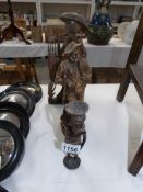 3 carved wood figures