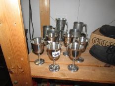 A mixed lot of pewter tankards,