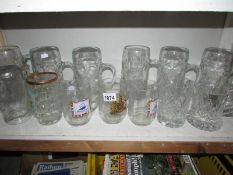 A large quantity of glass tankards and beer steins