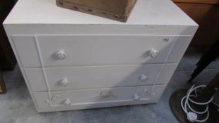 A 3 drawer white chest of drawers