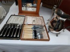 2 cased cutlery sets,