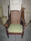 A cane backed arm chair