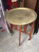 A brass tray table