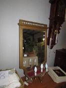 A gilt framed bevel edged mirror with lights