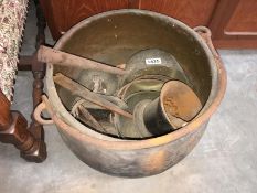 A large cauldron and other metalware