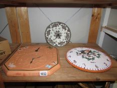 2 garden wall clocks and one other