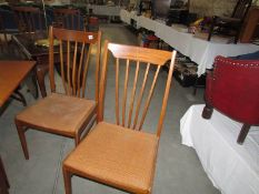 A set of 4 teak chairs