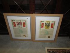 A pair of framed and glazed family coats of arms for Savadge and Simpson