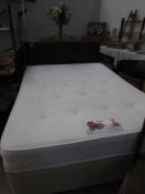 A good quality double divan bed with headboard