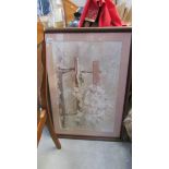 A large framed and glazed print