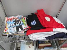 A quantity of England and Real Madrid football shirts and 'Four Four Two' football magazines