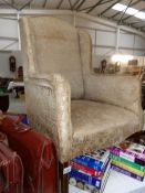 An Edwardian wing arm chair