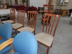 A set of 4 teak chairs