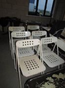 A set of 6 metal folding chairs