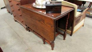 An oak barley twist gate leg table