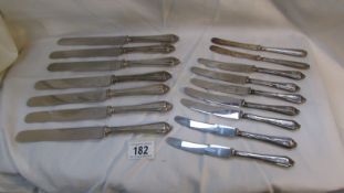 16 silver handled knives