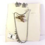 A vintage diamonte necklace. earrings and brooch