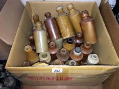 A box of vintage stone ware bottles