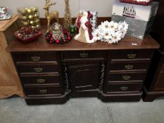 A mahogany breakfront kneehole desk