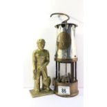 A 'Davy' lamp and a heavy brass miner figure