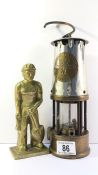 A 'Davy' lamp and a heavy brass miner figure