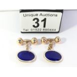 A pair of 9ct gold and enamel cuff links