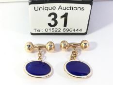 A pair of 9ct gold and enamel cuff links