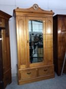A pine wardrobe with mirrored door