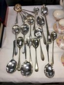 A mixed lot of serving spoons, ladles etc