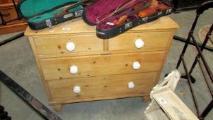 A pine 2 over 2 chest of drawers