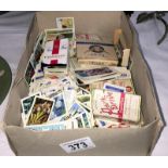 A box of loose cigarette cards