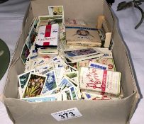 A box of loose cigarette cards