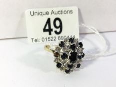 A large 9ct gold sapphire and diamond ring, size U