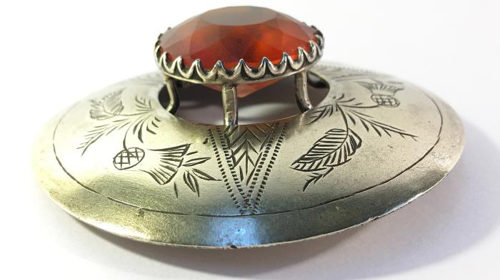 A large vintage Celtic silver coloured metal brooch with orange centre stone - Image 2 of 2