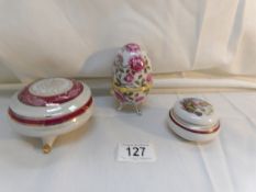 An egg shaped trinket box and 2 others