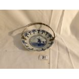 An unusual Delft blue and white dish with white metal handle