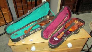 2 violins with cases