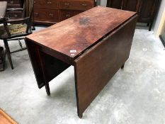 A mahogany drop leaf table