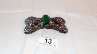 A Victorian cut steel buckle with 3 green stones