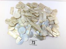 A large collection of mother of pearl counters