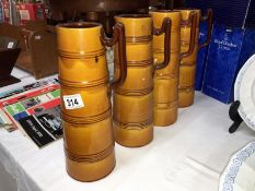 4 matching pottery jugs, some a/f