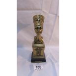 A brass bust of Nefertiti